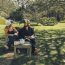 A Couple With Bird Hats In A Sunny Garden