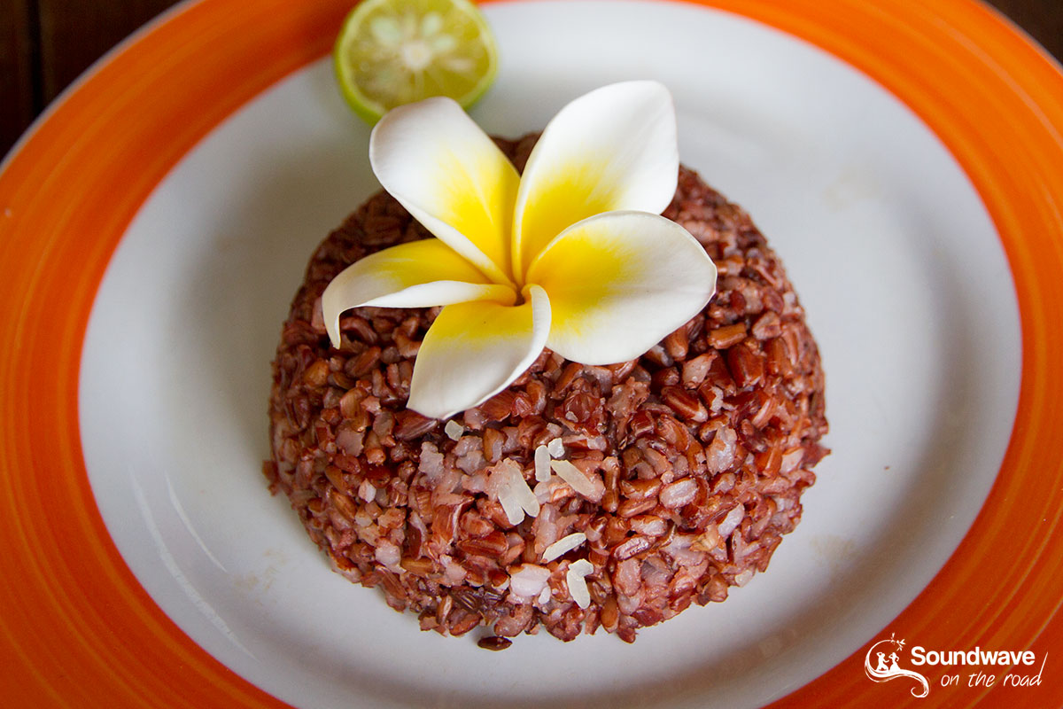Red rice and frangipani flower